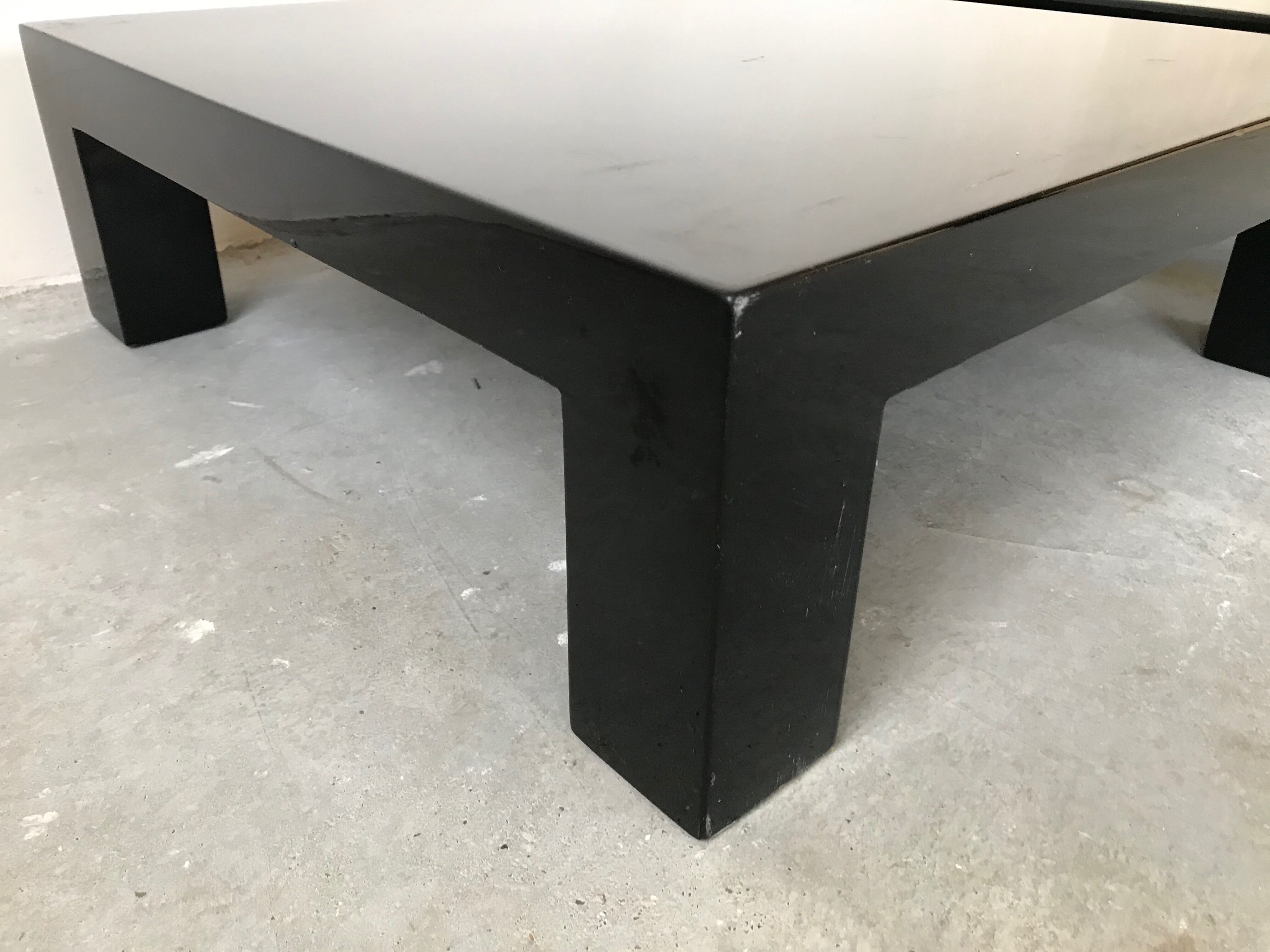 Pair of black laqué wood coffee tables, circa 1970.