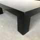 Paire de tables basses en bois laqué noir, circa 1970.