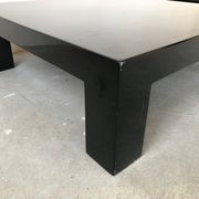 Pair of black laqué wood coffee tables, circa 1970.