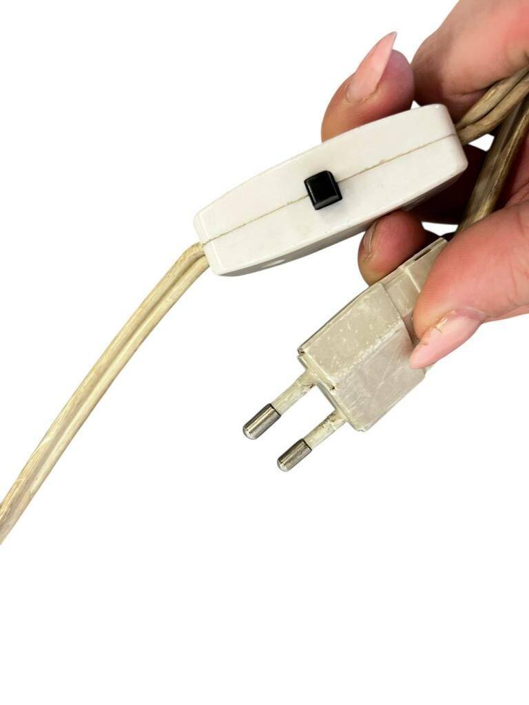 Vintage gold floor lamp with fringed shade.