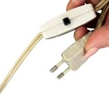 Vintage gold floor lamp with fringed shade.