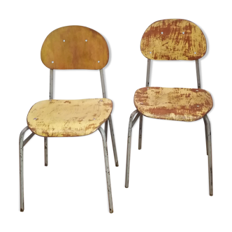 Pair of grey metal and yellow patinated metal child chairs