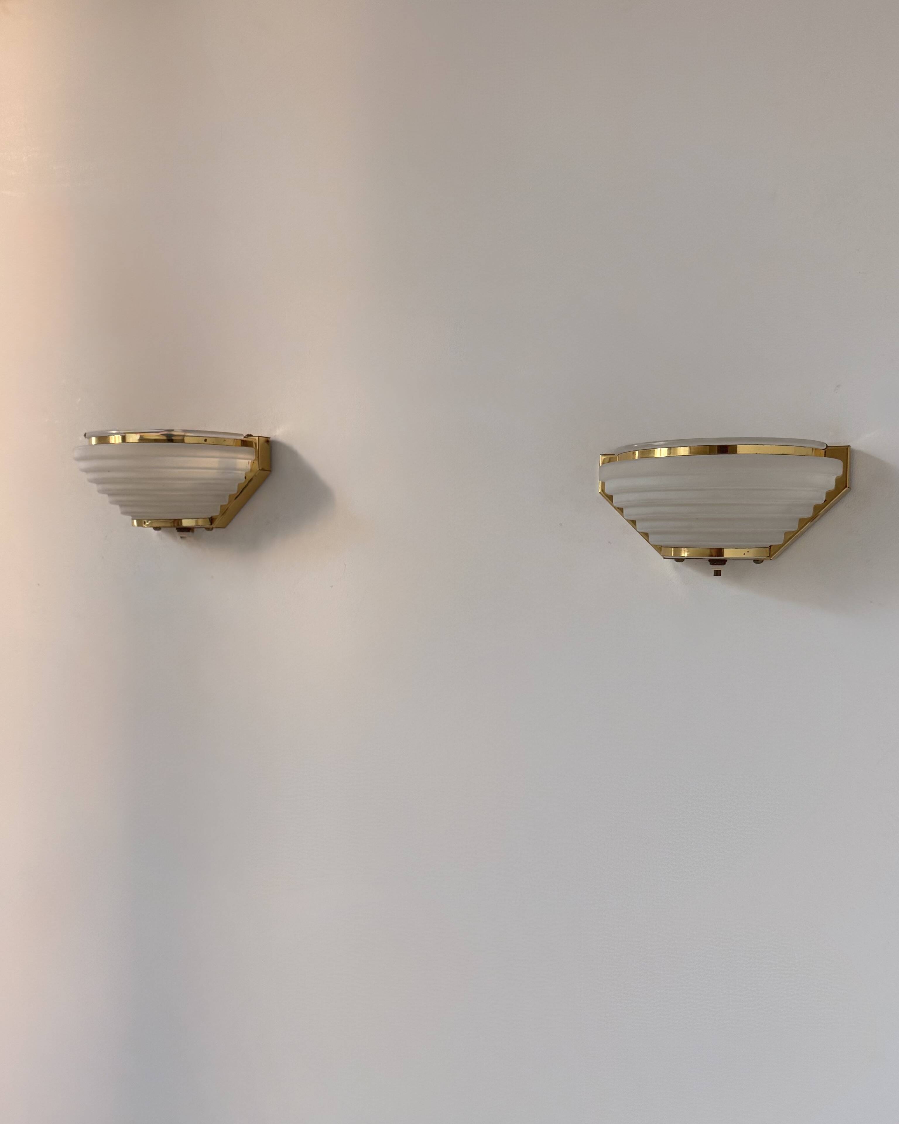Pair of vintage brass and frosted glass wall lights, France, 1970.