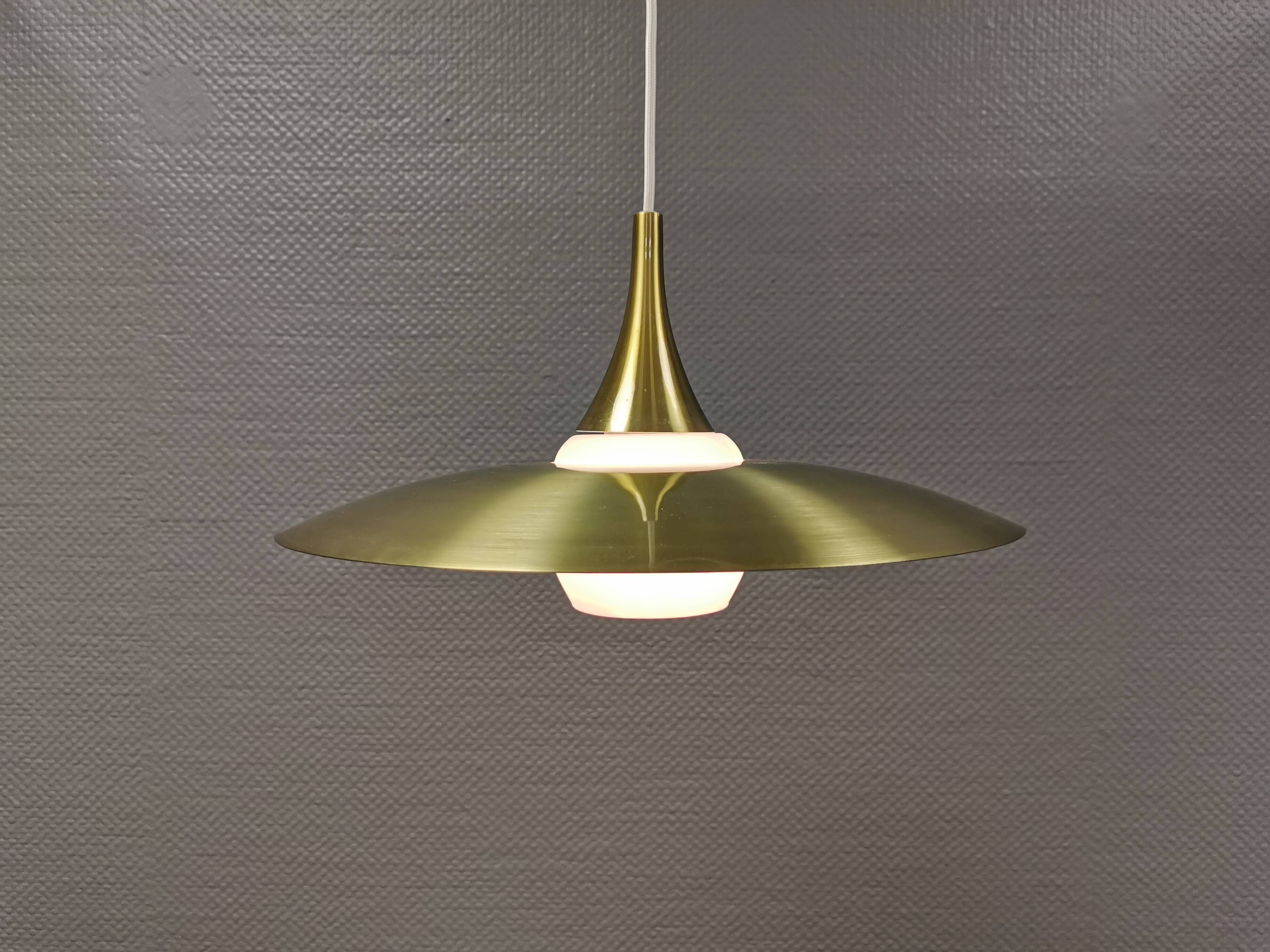 Hanging lamp, from the 1970s in matte white glass and brass colored metal.