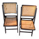 Pair of caned folding chairs from the 1960s in varnished wood.