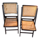 Pair of 1960s cane folding chairs in varnished wood.