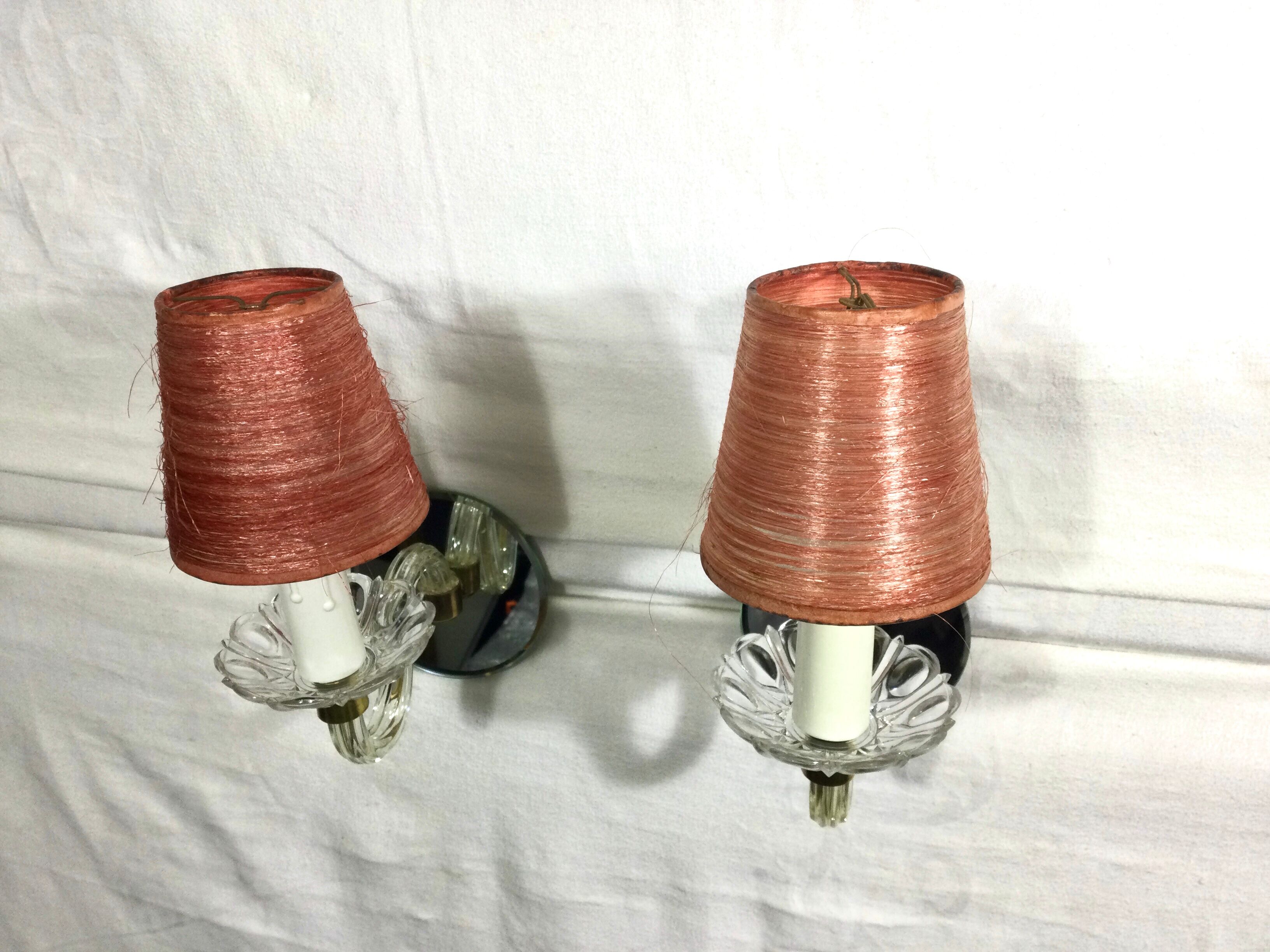 Pair of glass and mirror sconces