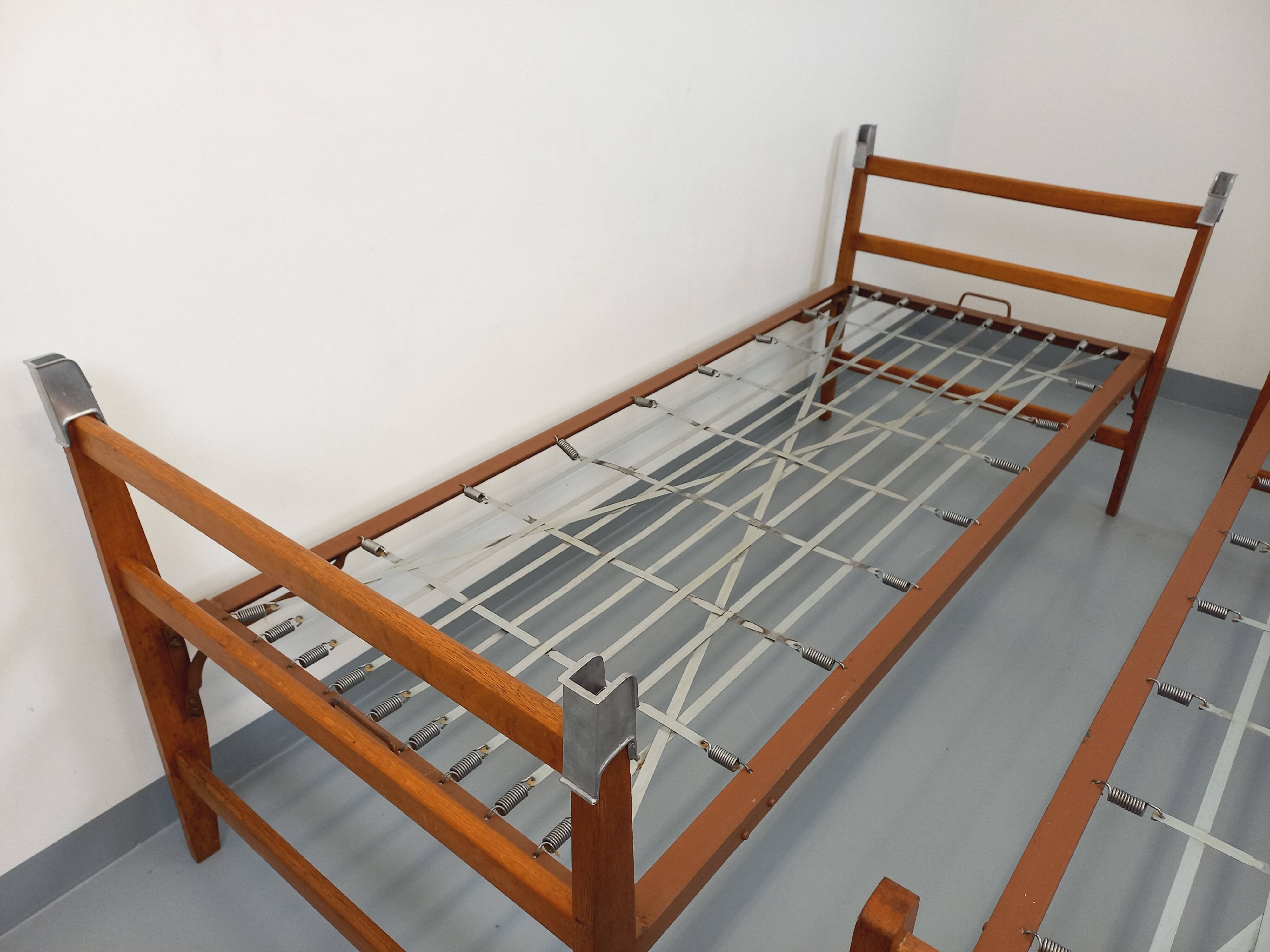 Pair of vintage stackable daybeds in oak wood and metal from the 60s