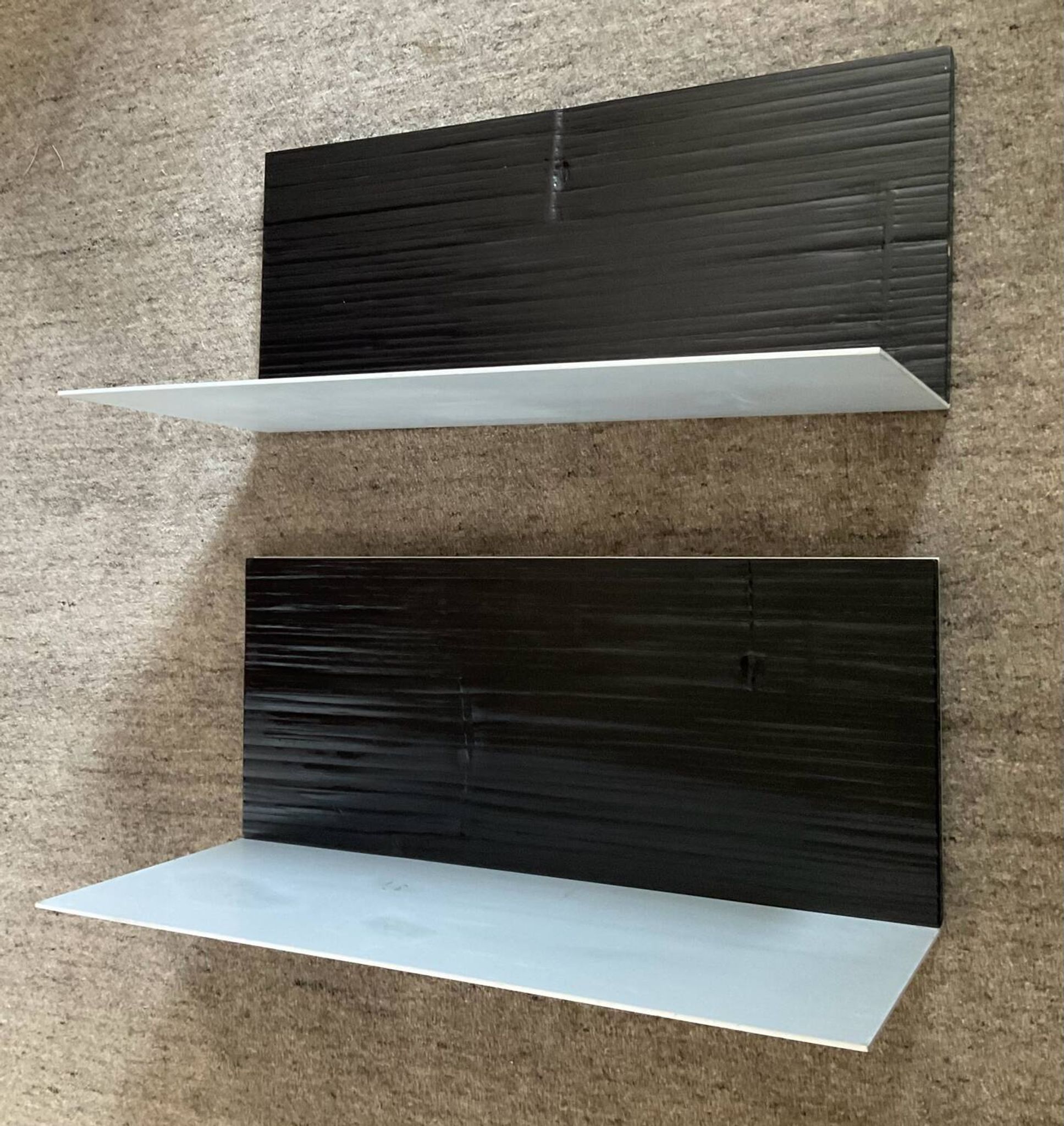 Pair of contemporary shelves in steel and stained wood