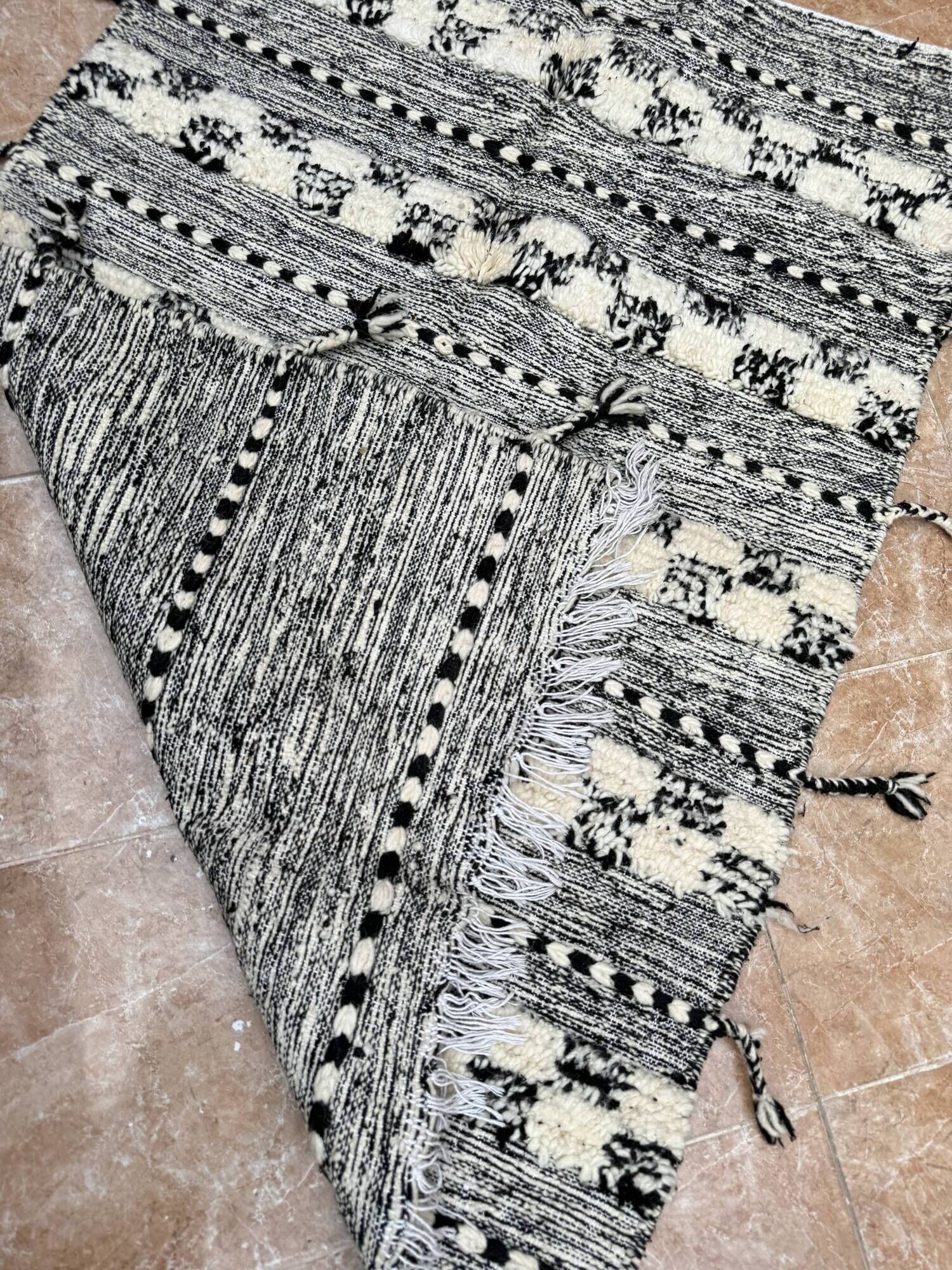 Small black Moroccan Berber Zanafi kilim rug for bedroom and living room.