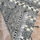 Small black Moroccan Berber Zanafi kilim rug for bedroom and living room.