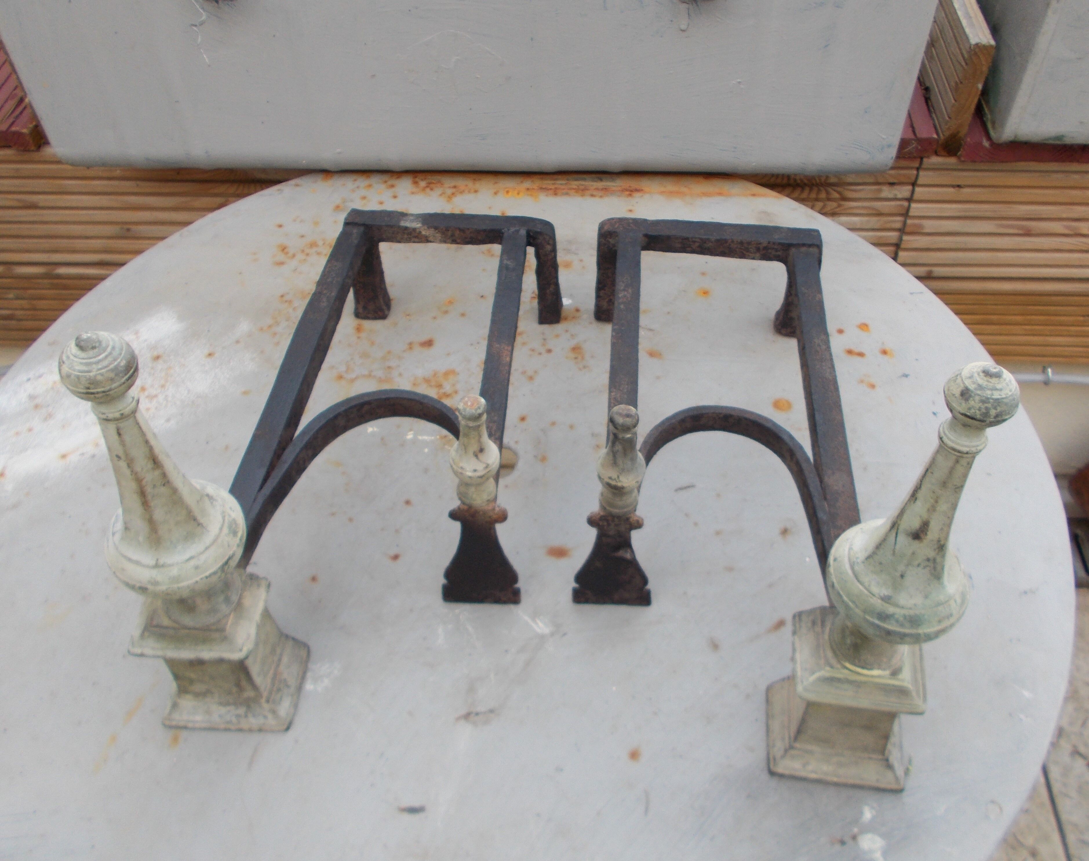Old pair of wrought iron and bronze pegs