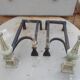 Old pair of wrought iron and bronze pegs