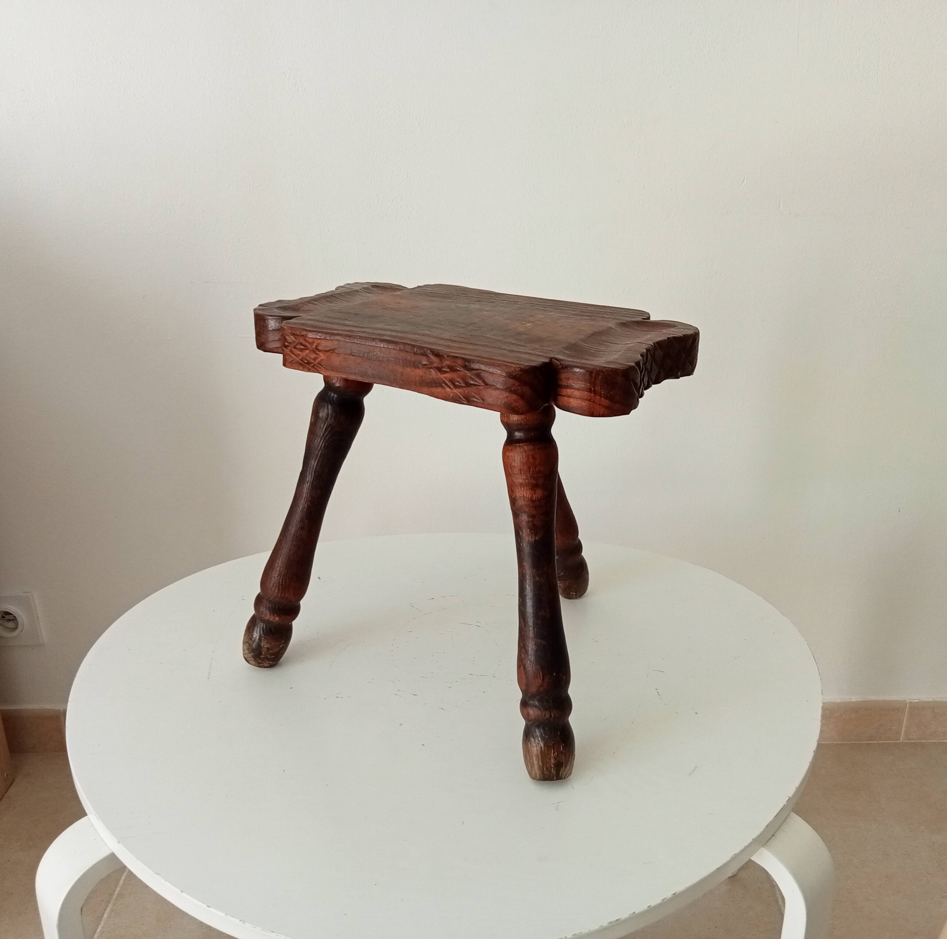 Brutalist Spanish tripod stool in solid carved wood.