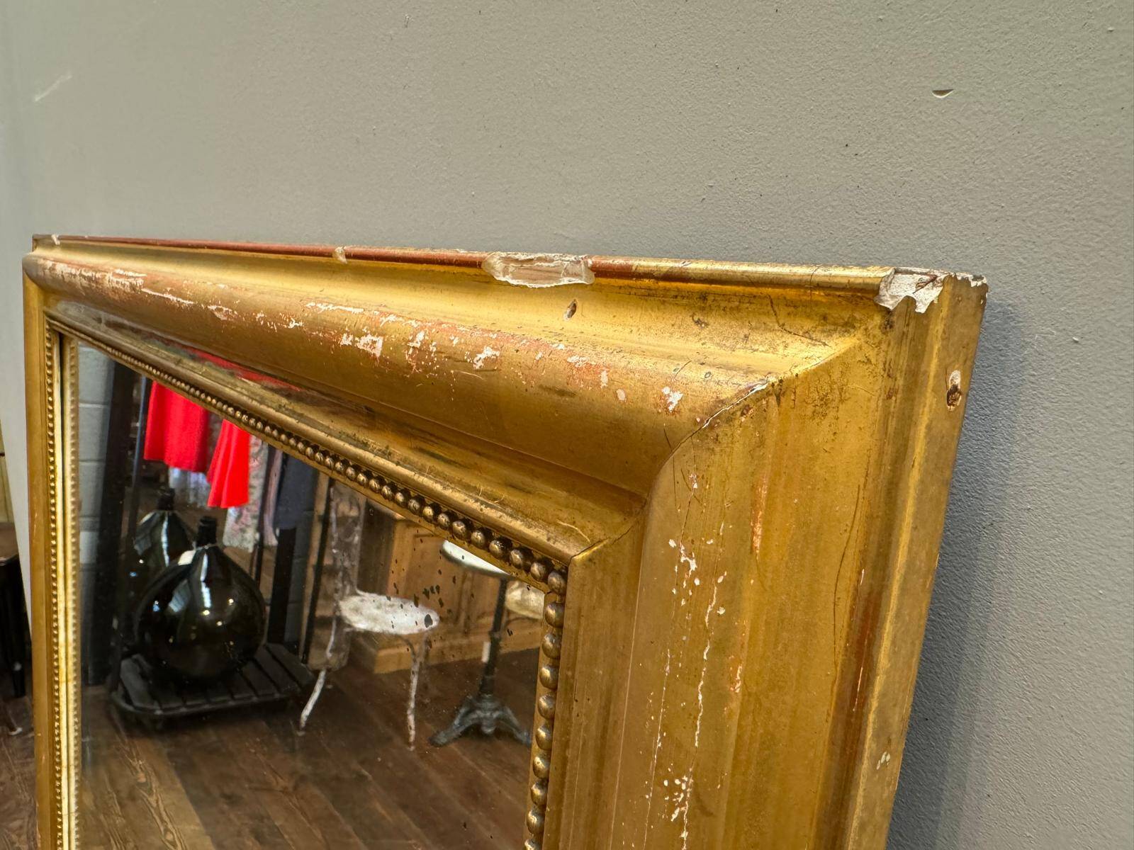 Antique gilded fireplace mirror