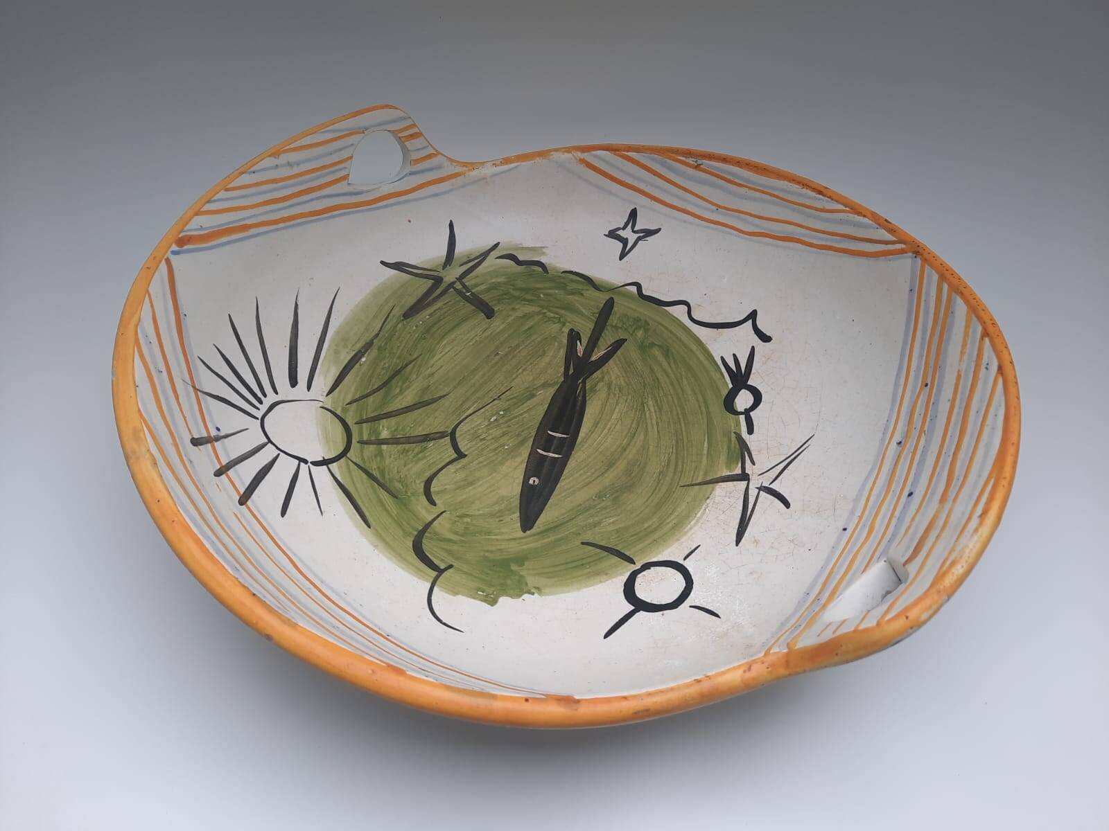 Vallauris 1950 Vintage cup with sun, star, and fish patterns.