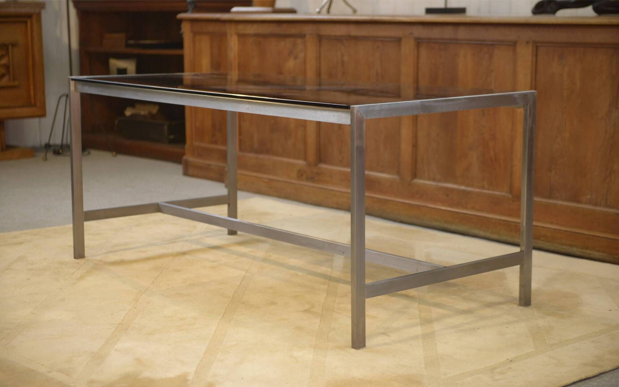 Brushed stainless steel and smoked black glass desk from the 1980s.