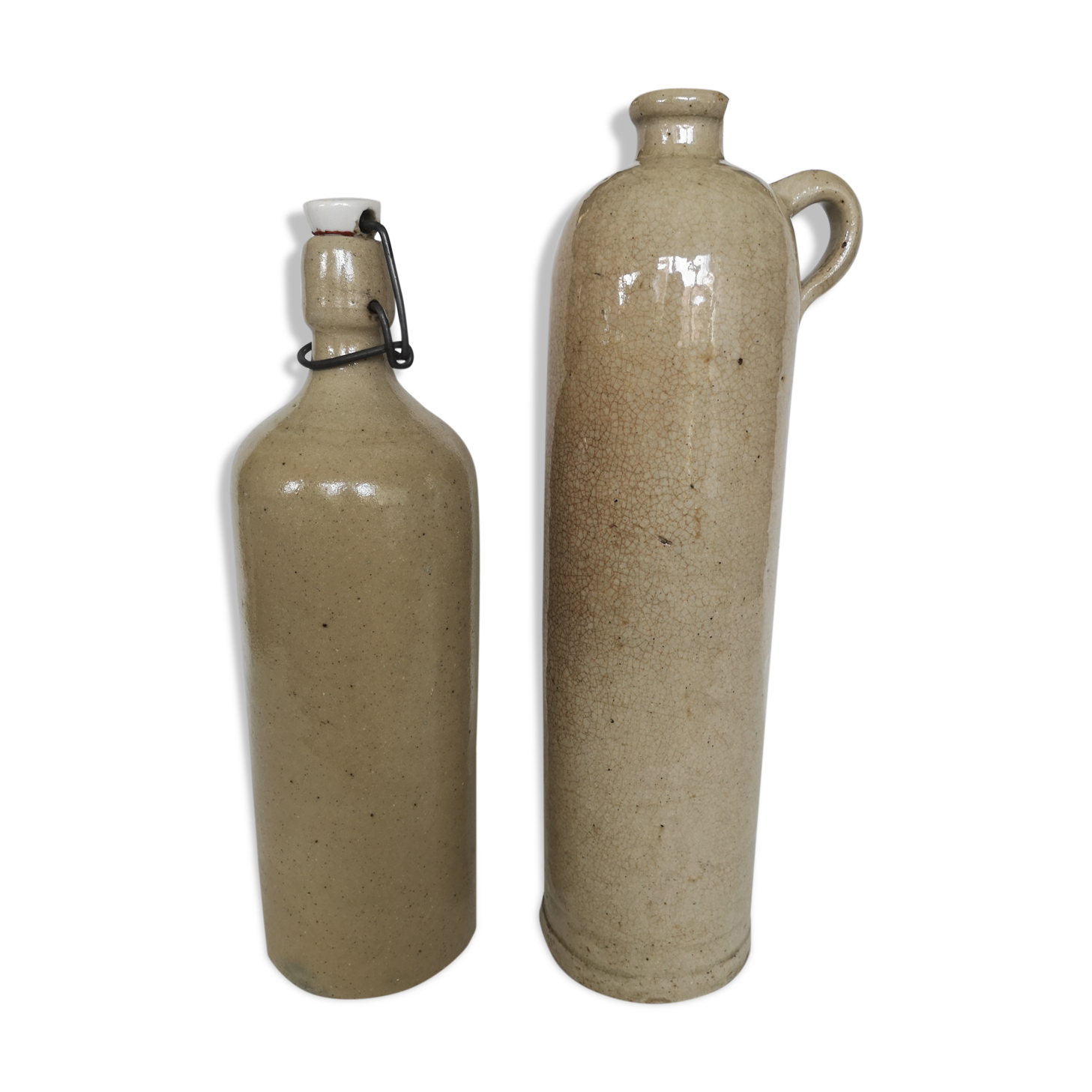 Pair of enamelled sandstone bottles