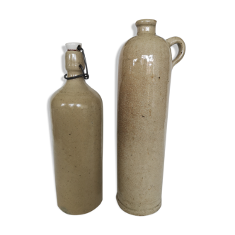 Pair of enamelled sandstone bottles