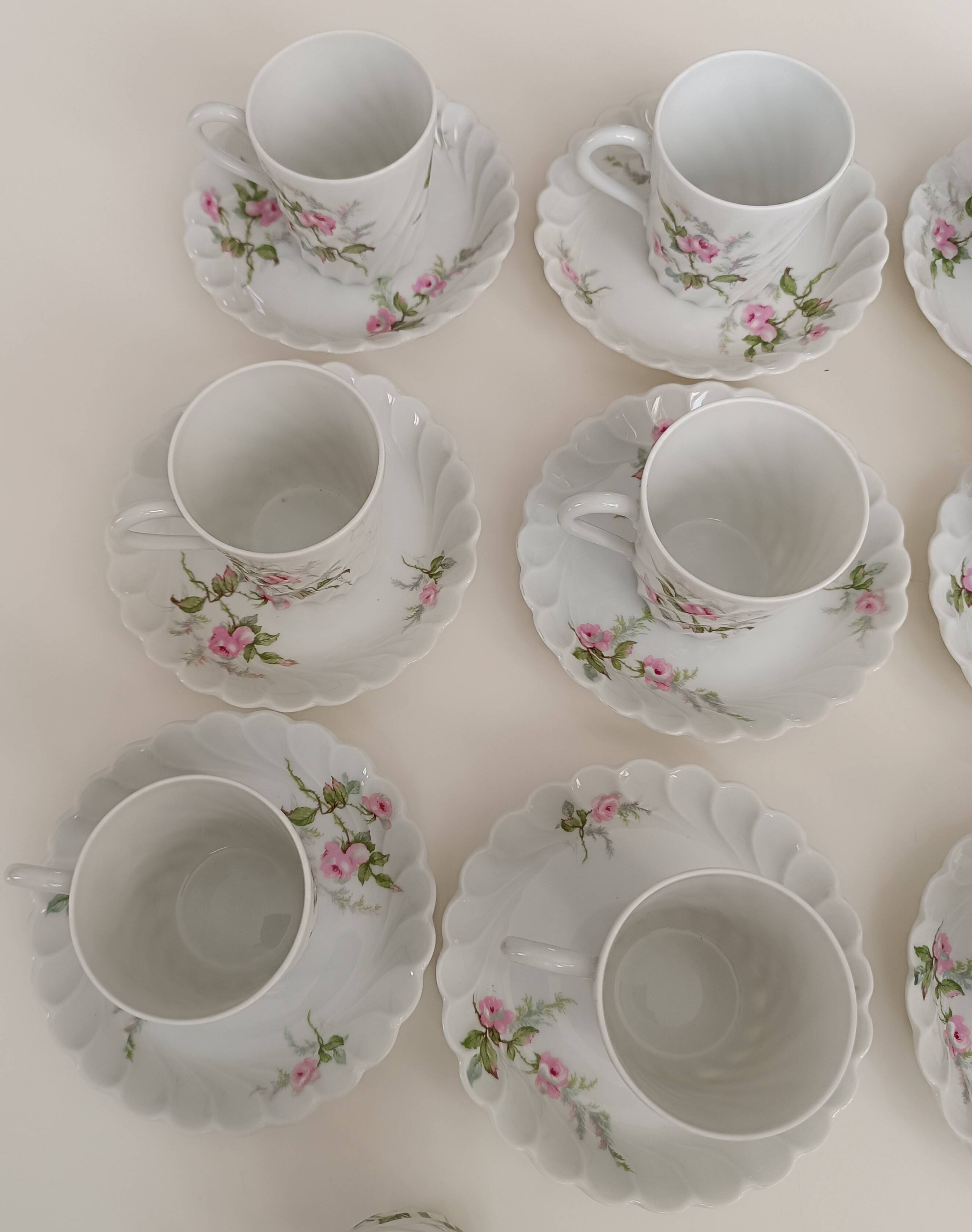 Haviland Limoges porcelain 10 coffee cups and 9 saucers with floral decoration.
