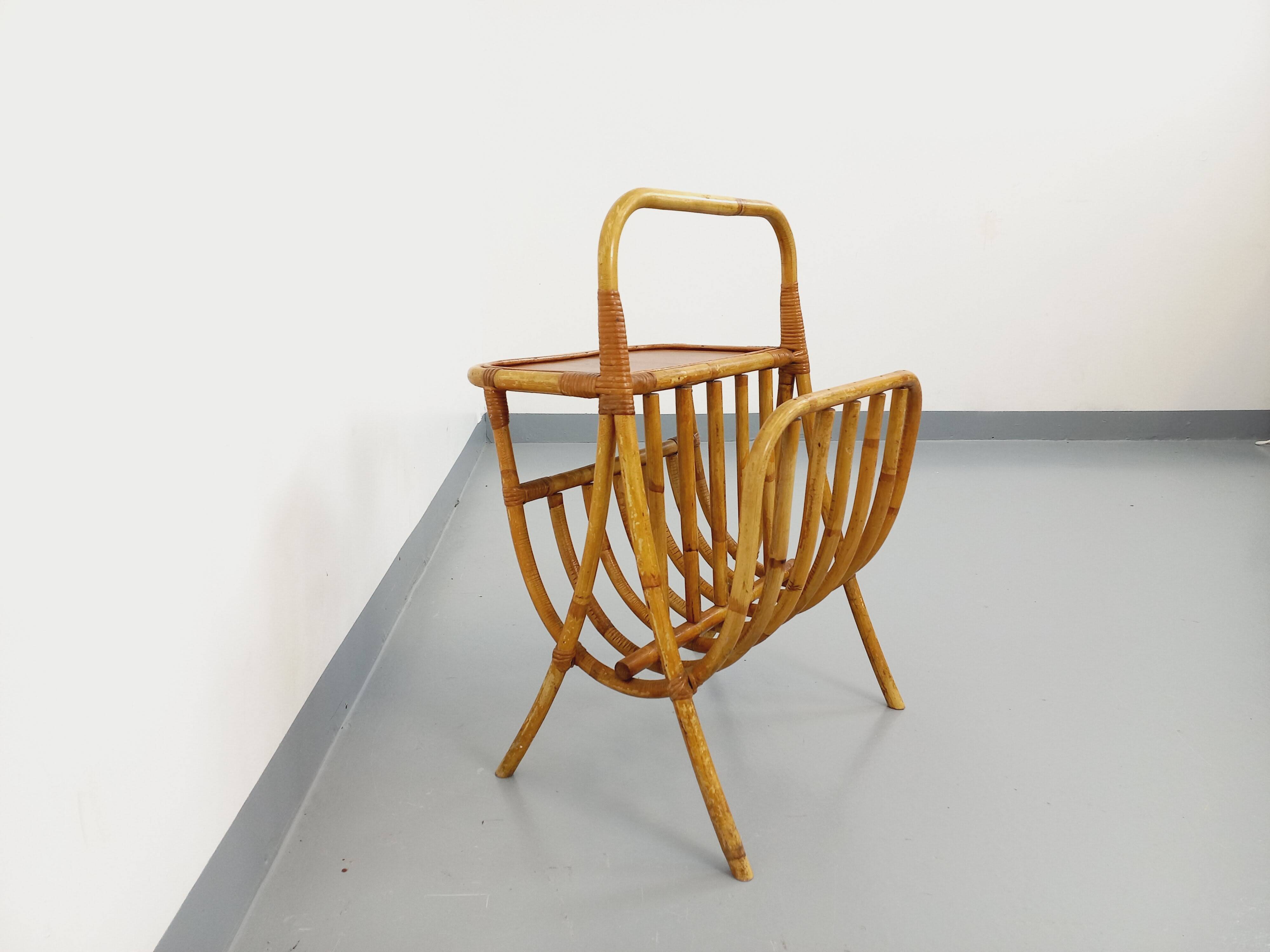 Side table with vintage rattan and wood magazine rack from the 60s