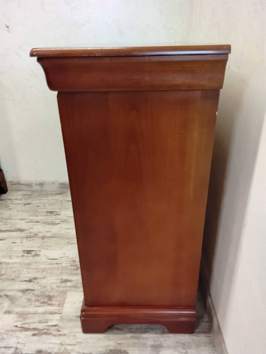 Wooden chest of drawers with a secret drawer