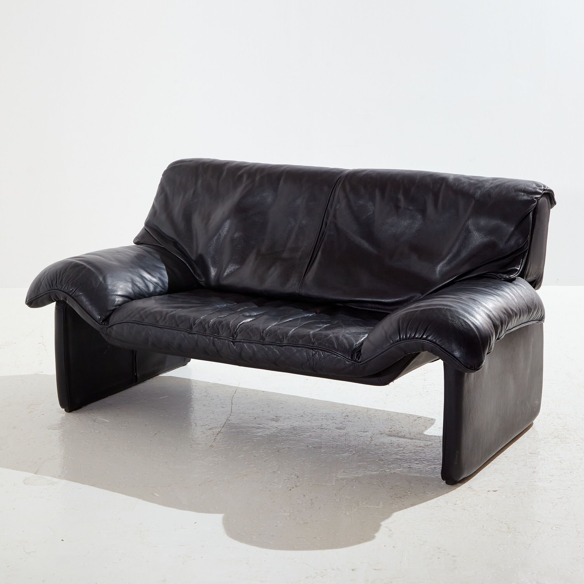 Two-seater leather sofa