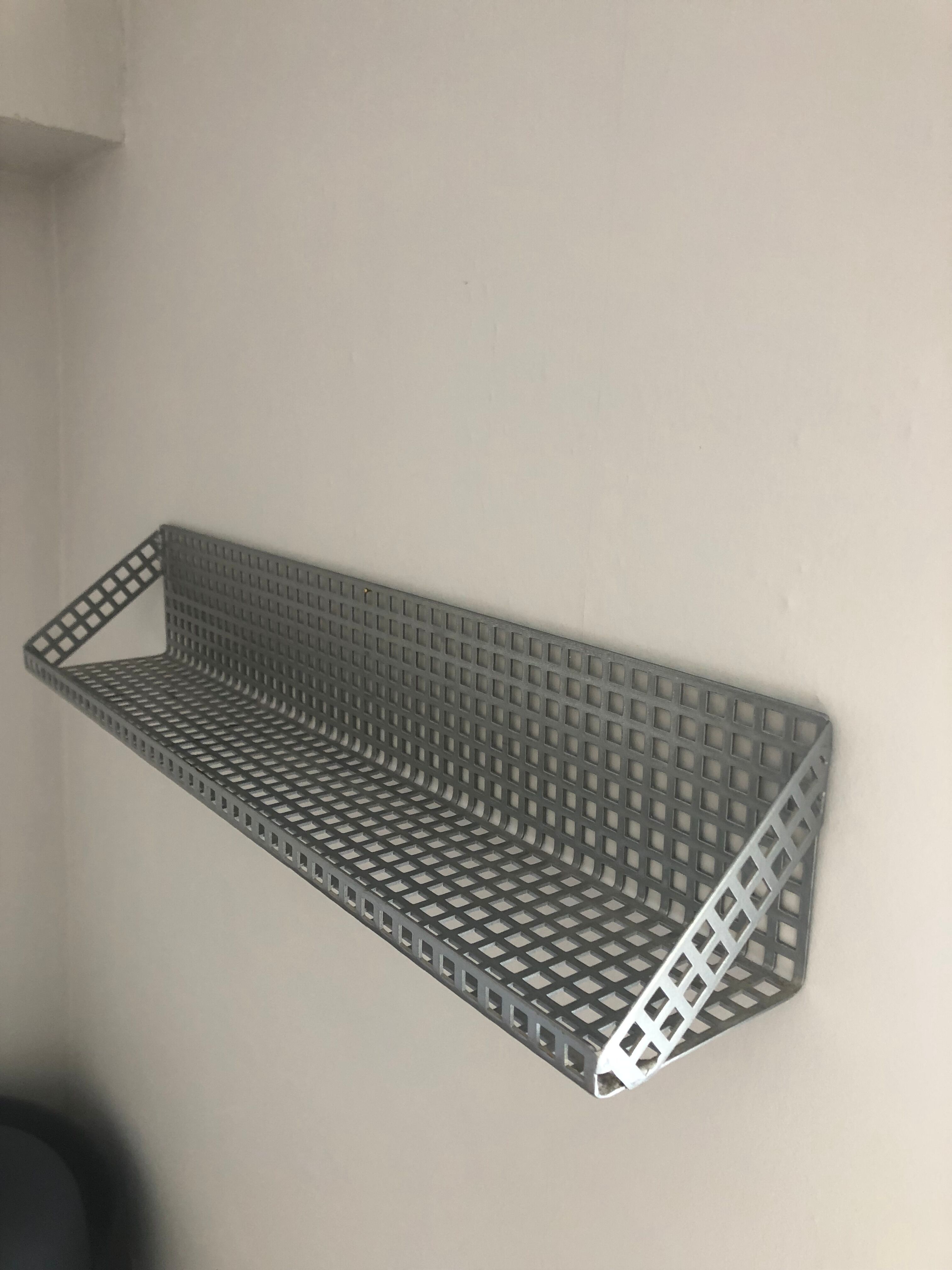 Vintage perforated sheet metal shelf