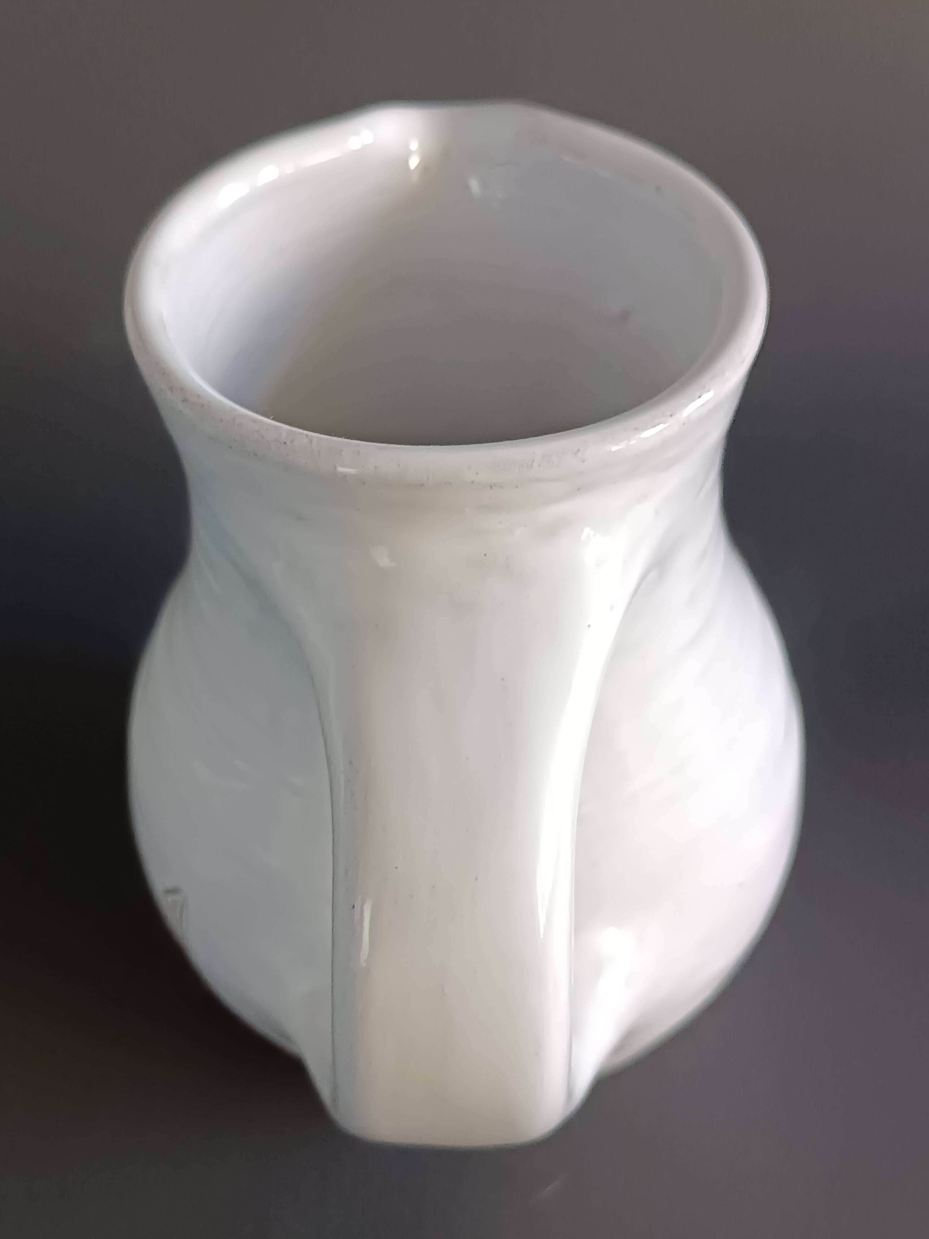 Vintage white glazed ceramic pitcher signed