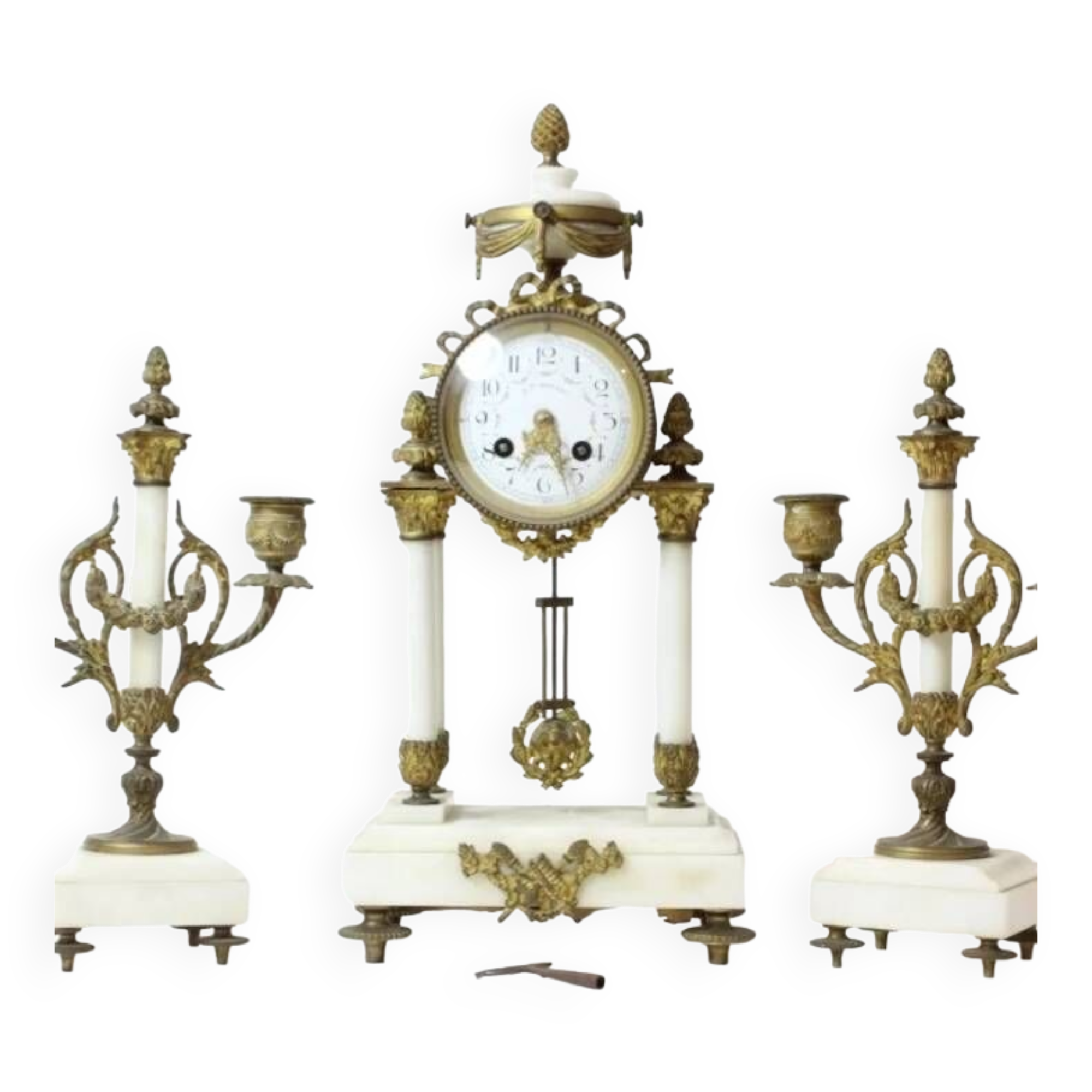Clock and pair of Louis XVI style candelabras.