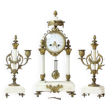 Clock and pair of Louis XVI style candelabras.