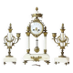 Clock and pair of Louis XVI style candelabras.