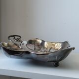 Old empty cut pocket in silver metal art nouveau in the shape of a sheet
