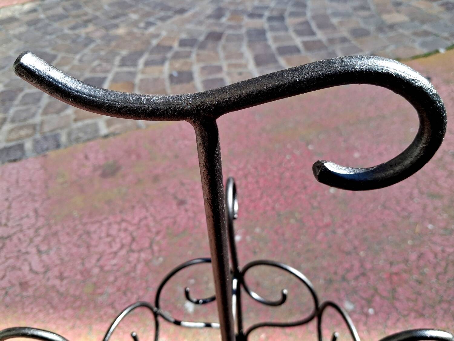 Antique wrought iron umbrella stand for entrance hall, vintage decor.