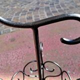 Antique wrought iron umbrella stand for entrance hall, vintage decor.