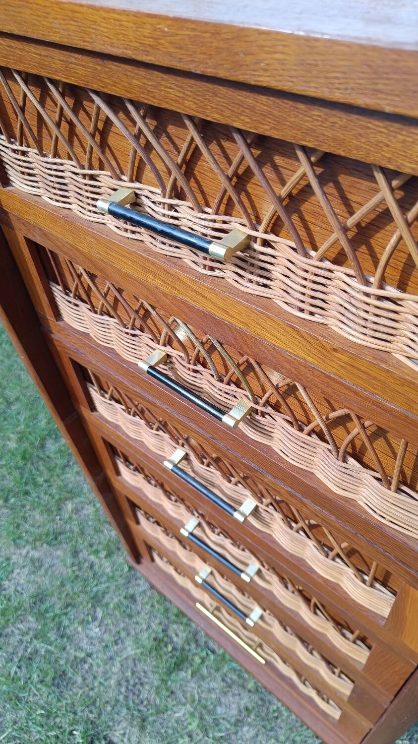 Tall chest of drawers in wood and rattan with splayed legs
