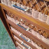 Tall chest of drawers in wood and rattan with splayed legs