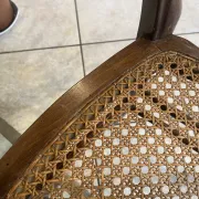 Pair of antique caned and wooden chairs from the 1900s.