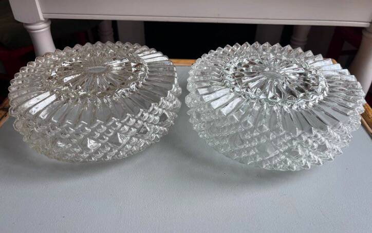Pair of round vintage moulded glass ceiling lights.