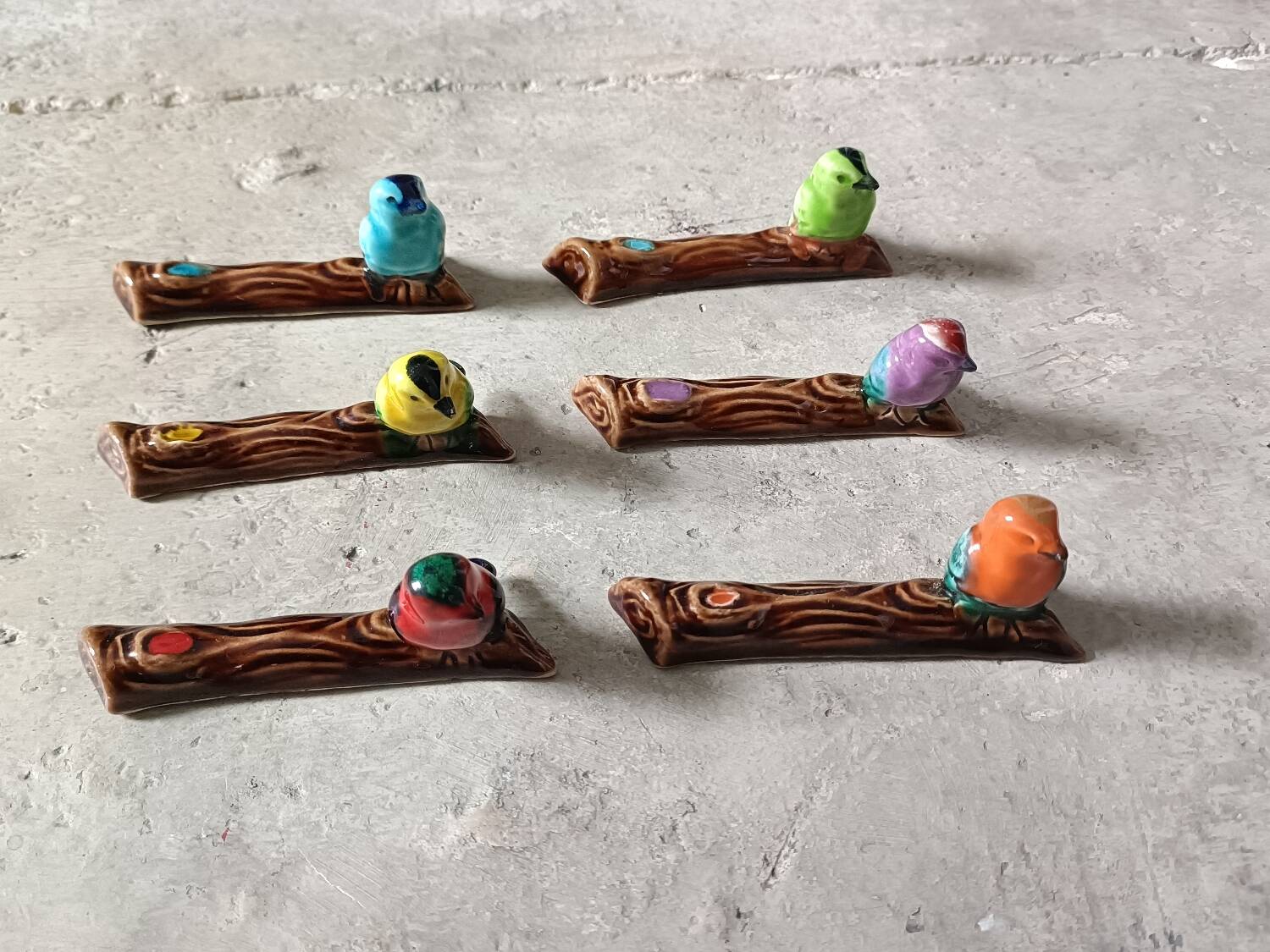 Set of six barbotine bird knife rests