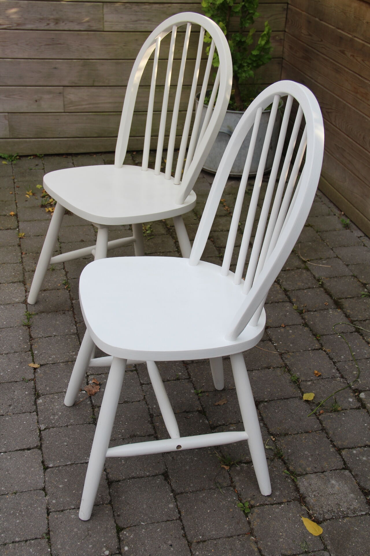 Two  white repainted chairs