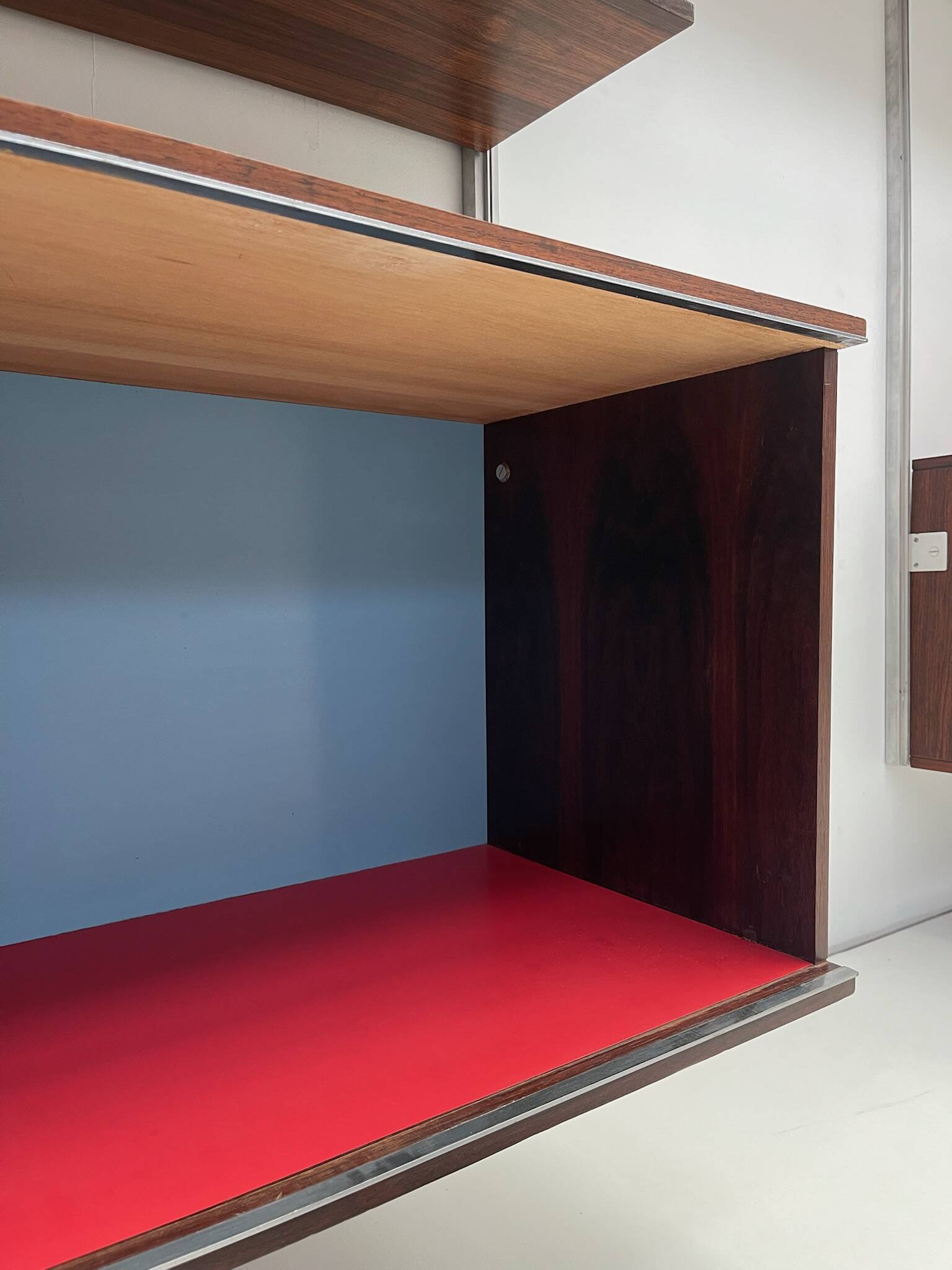 Large colorful wall unit in luxury wood