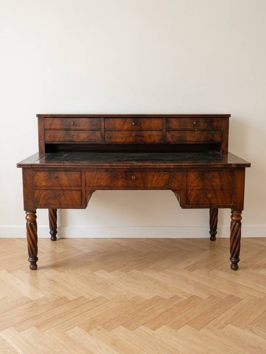 Antique wooden tiered desk with drawers and twisted legs.