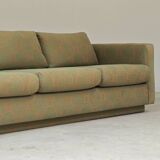 Pierre Frey modernist bench in green and gold patterned fabric