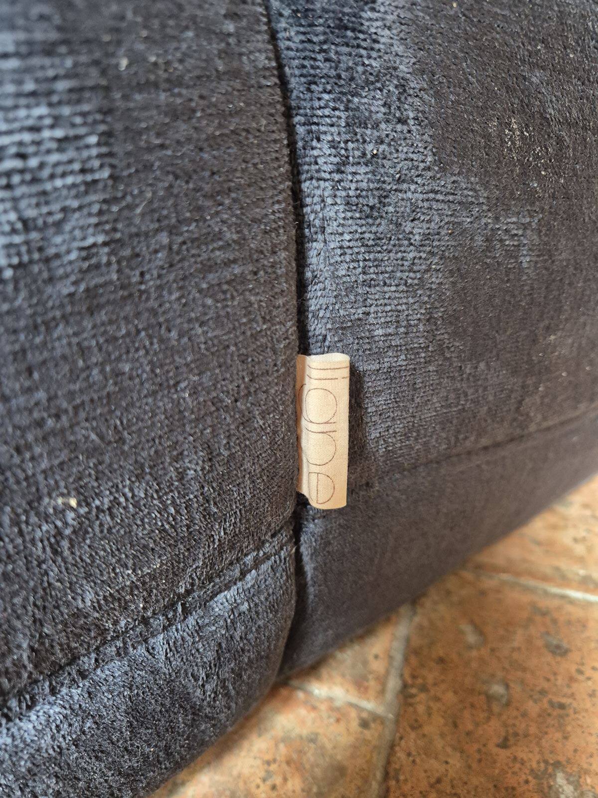 Togo sofa by Ligne Roset and its pouf from the 1970s.