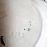 Antique earthenware plates with fruit decoration.