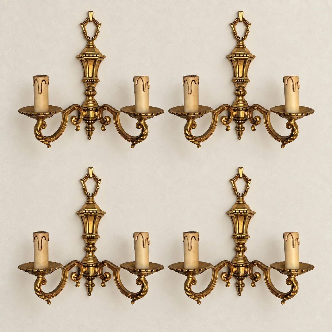 Set of four two-light wall sconces in gilded brass — Louis XVI style