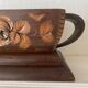 Art Deco jardinière in carved wood, decorated with roses.