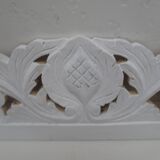 Decorative pediment in white carved wood