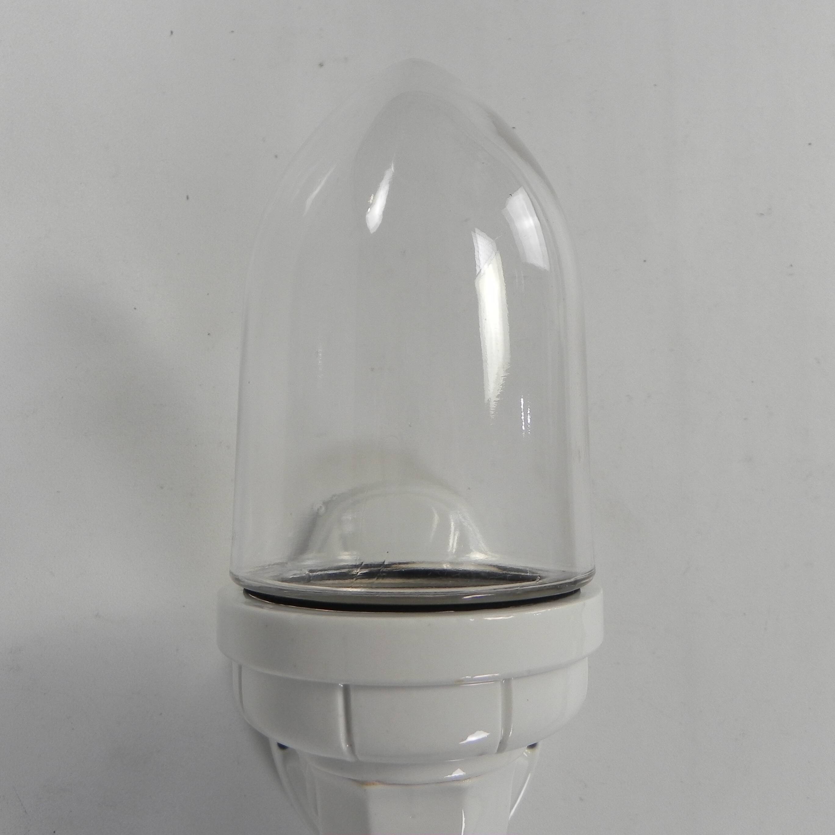 Wall lamp in porcelain with a transparent glass shade, 1930s.